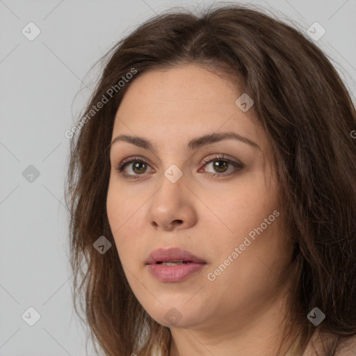 Neutral white young-adult female with long  brown hair and brown eyes