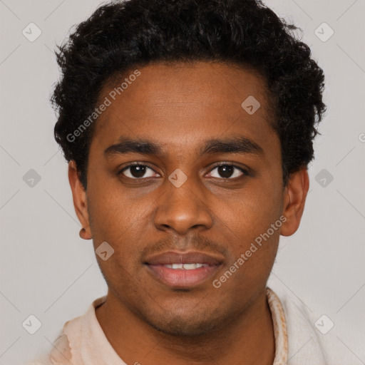 Joyful black young-adult male with short  brown hair and brown eyes