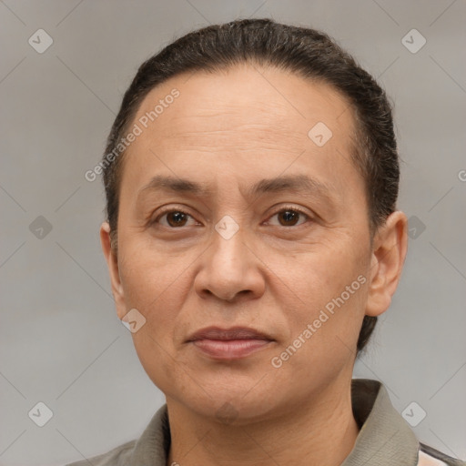 Joyful white adult female with short  brown hair and brown eyes