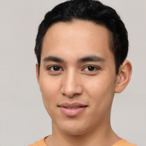 Joyful asian young-adult male with short  black hair and brown eyes