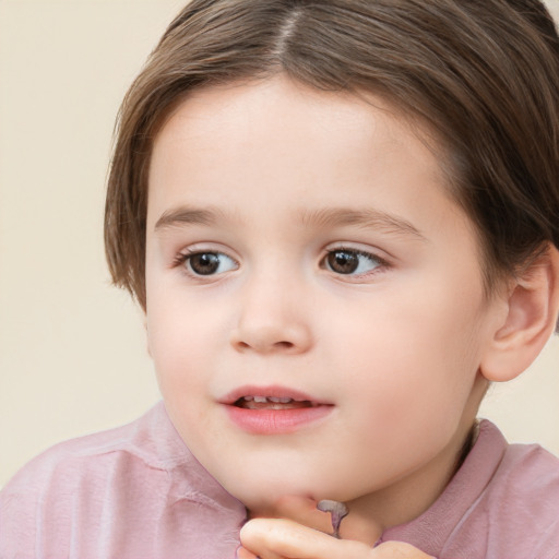 Joyful white child female with short  brown hair and brown eyes