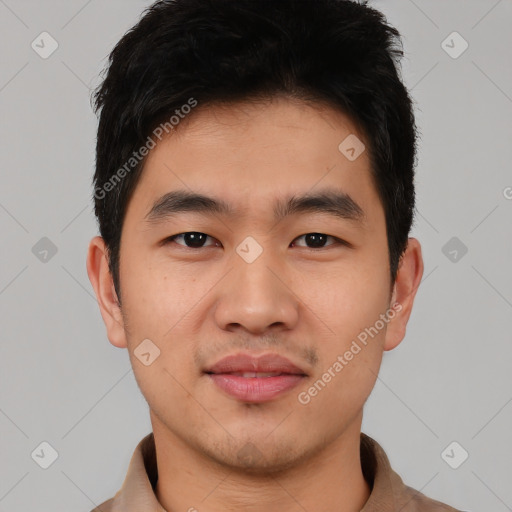 Joyful asian young-adult male with short  black hair and brown eyes