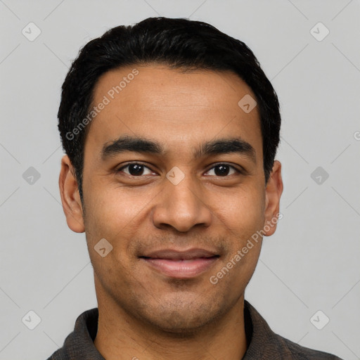 Joyful latino young-adult male with short  black hair and brown eyes