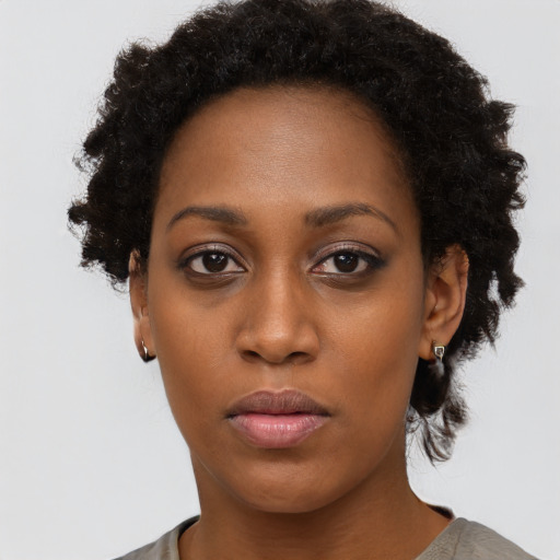 Neutral black young-adult female with short  black hair and brown eyes