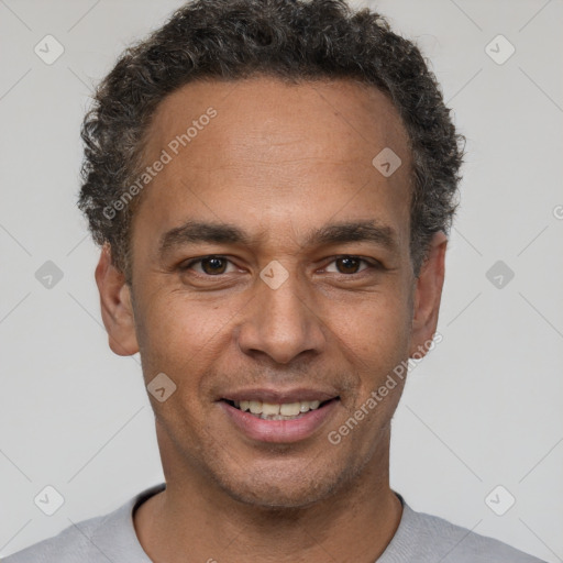 Joyful latino young-adult male with short  brown hair and brown eyes