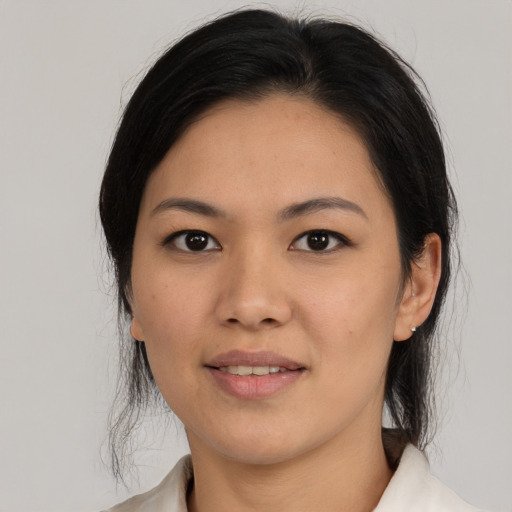Joyful asian young-adult female with medium  black hair and brown eyes