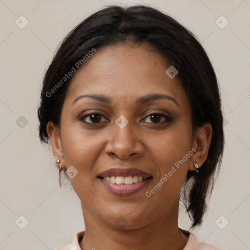 Joyful black adult female with medium  brown hair and brown eyes