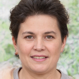 Joyful white adult female with short  brown hair and brown eyes