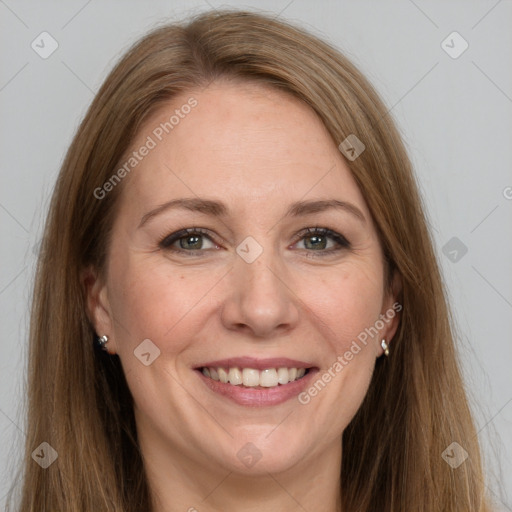 Joyful white adult female with long  brown hair and grey eyes