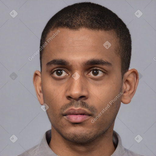 Neutral latino young-adult male with short  black hair and brown eyes