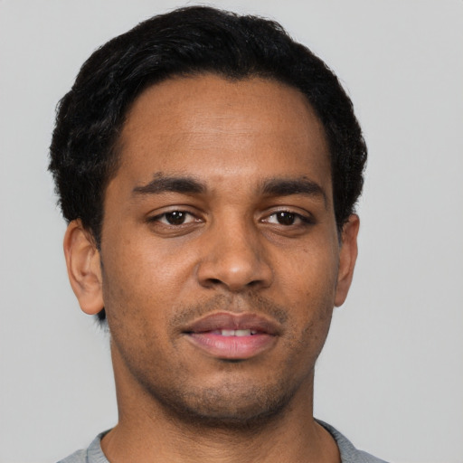 Neutral black young-adult male with short  black hair and brown eyes
