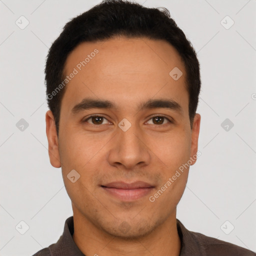 Joyful latino young-adult male with short  brown hair and brown eyes