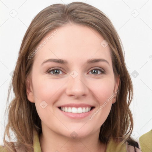 Joyful white young-adult female with long  brown hair and grey eyes