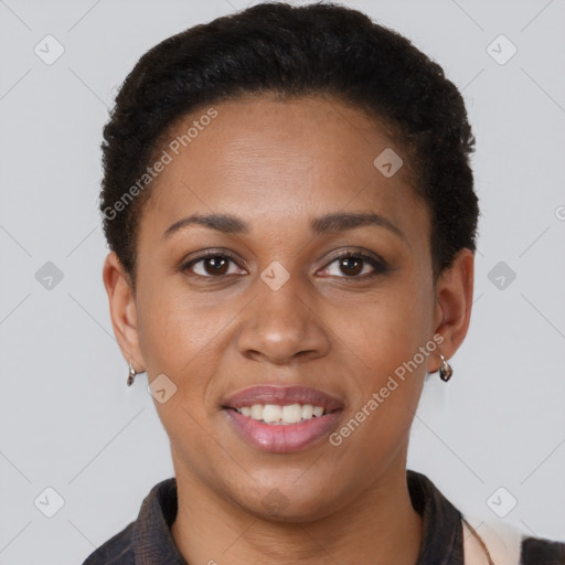 Joyful black young-adult female with short  brown hair and brown eyes