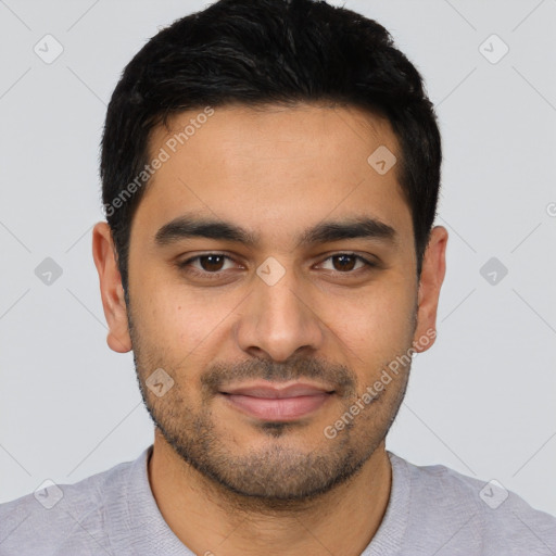 Joyful latino young-adult male with short  black hair and brown eyes