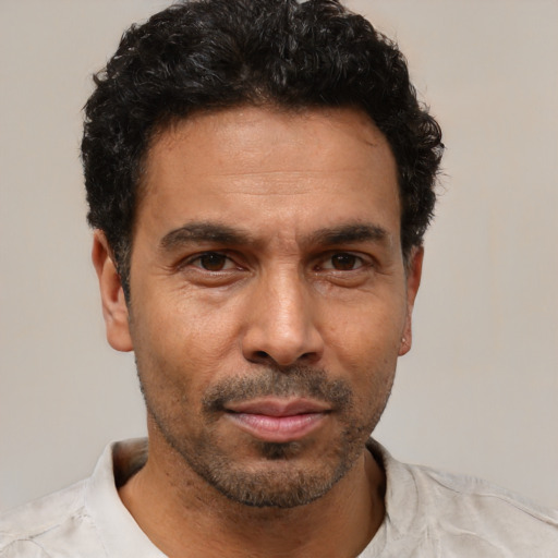 Neutral latino adult male with short  black hair and brown eyes