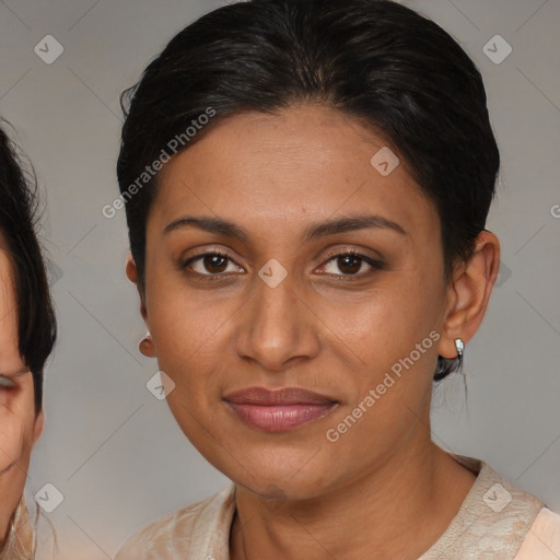 Joyful latino young-adult female with medium  brown hair and brown eyes