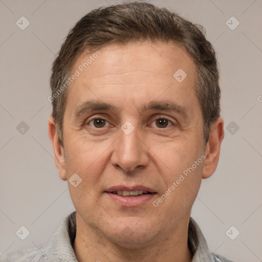 Joyful white adult male with short  brown hair and brown eyes