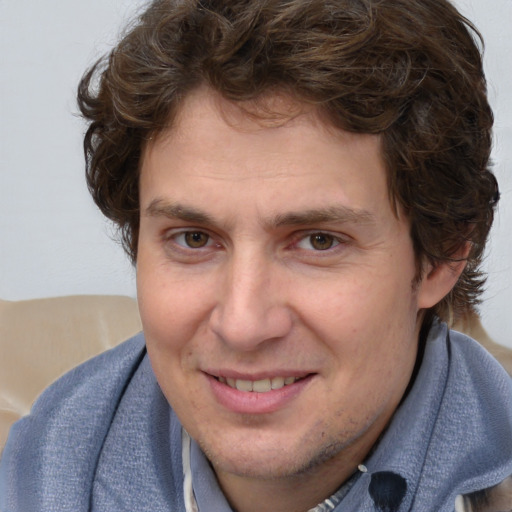 Joyful white young-adult male with medium  brown hair and brown eyes