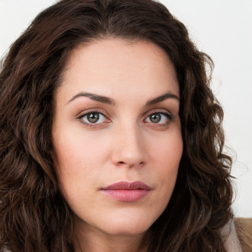 Neutral white young-adult female with long  brown hair and green eyes