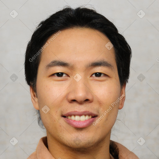 Joyful asian young-adult male with short  black hair and brown eyes