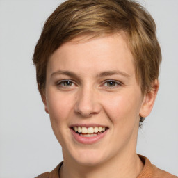 Joyful white young-adult female with short  brown hair and grey eyes