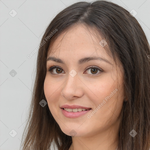 Joyful white young-adult female with long  brown hair and brown eyes