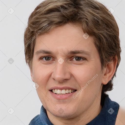 Joyful white adult male with short  brown hair and grey eyes