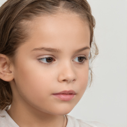 Neutral white child female with medium  brown hair and brown eyes