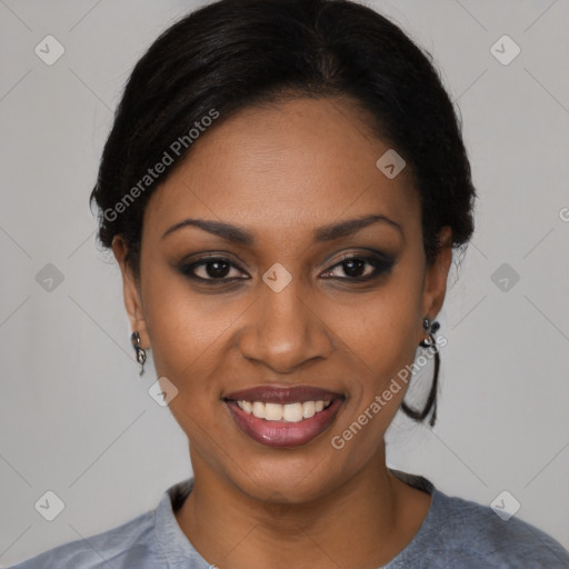 Joyful black young-adult female with short  black hair and brown eyes