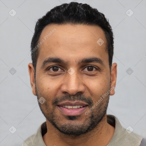 Joyful latino young-adult male with short  black hair and brown eyes