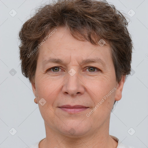 Joyful white adult female with short  brown hair and brown eyes