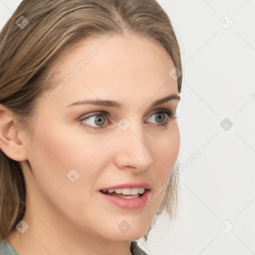 Joyful white young-adult female with medium  brown hair and blue eyes