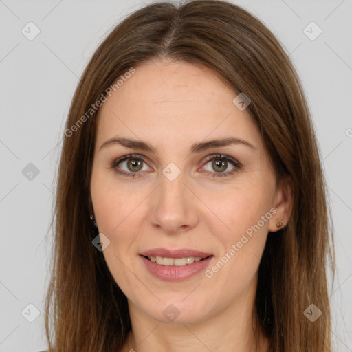 Joyful white adult female with long  brown hair and brown eyes