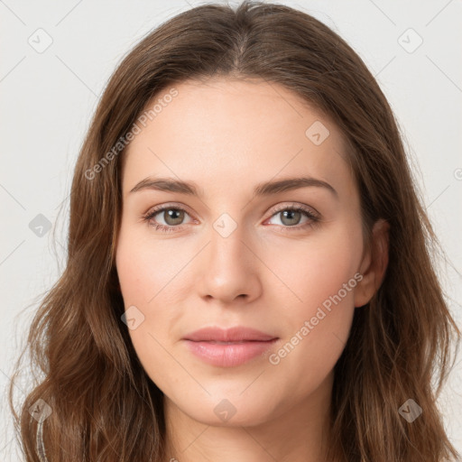 Joyful white young-adult female with long  brown hair and green eyes