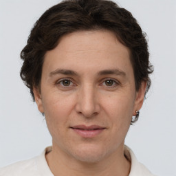 Joyful white adult female with short  brown hair and brown eyes