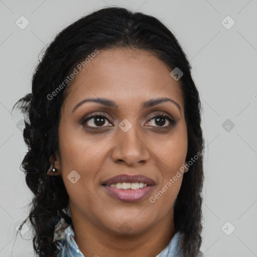 Joyful black young-adult female with long  brown hair and brown eyes