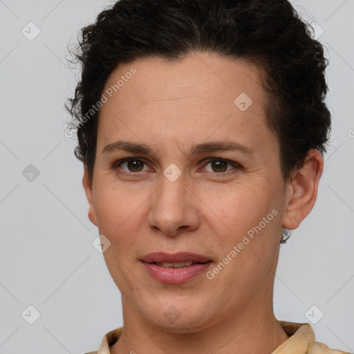 Joyful white adult female with short  brown hair and brown eyes