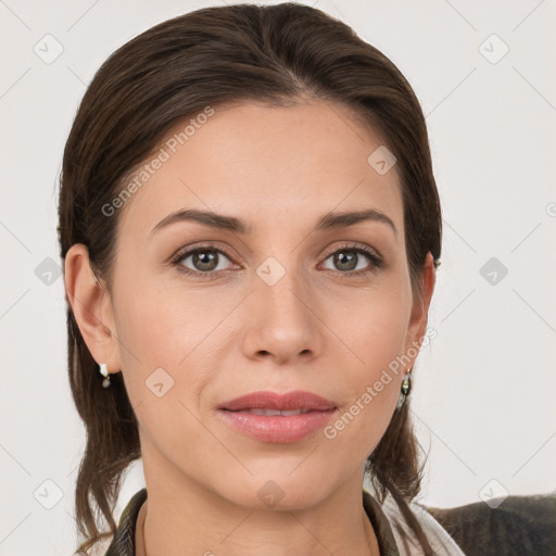 Joyful white young-adult female with medium  brown hair and grey eyes