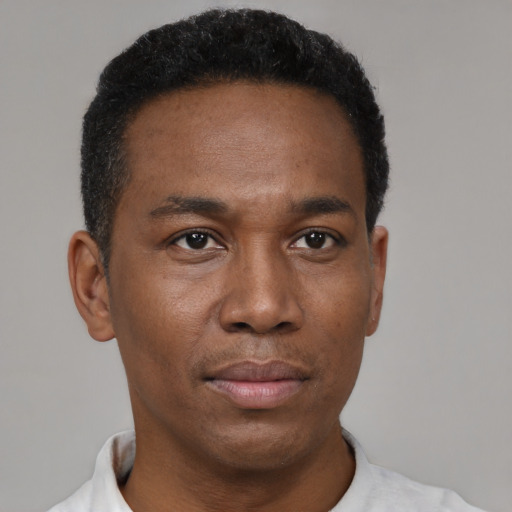 Neutral black adult male with short  black hair and brown eyes