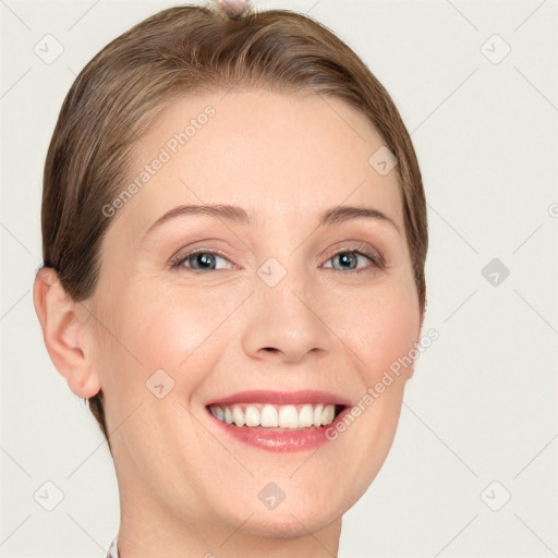 Joyful white young-adult female with short  brown hair and grey eyes