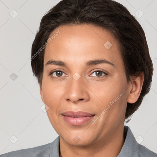 Joyful white adult female with short  brown hair and brown eyes