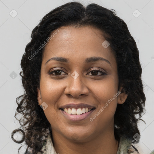 Joyful black young-adult female with long  brown hair and brown eyes