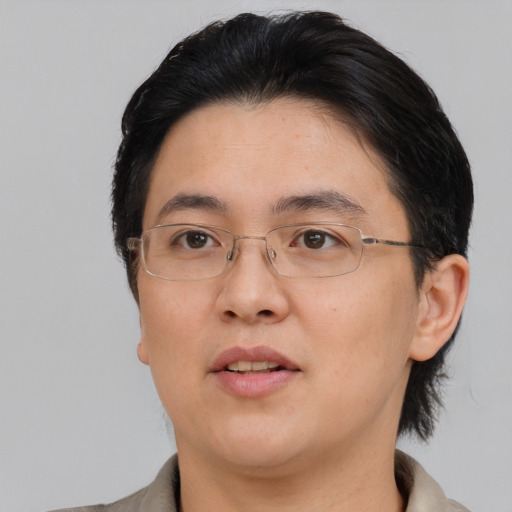 Neutral asian adult female with medium  black hair and brown eyes