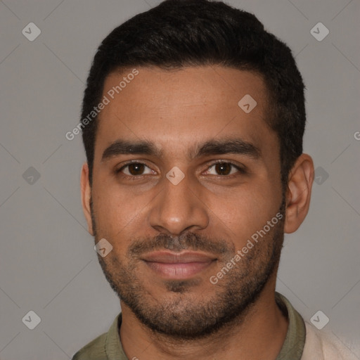 Joyful black young-adult male with short  brown hair and brown eyes