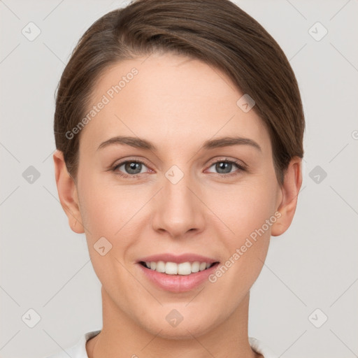 Joyful white young-adult female with short  brown hair and grey eyes