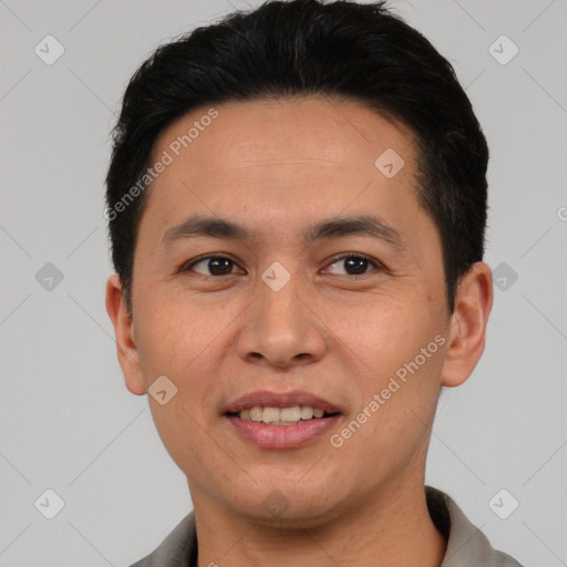 Joyful white young-adult male with short  black hair and brown eyes