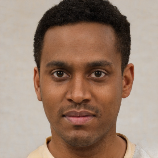 Neutral latino young-adult male with short  brown hair and brown eyes