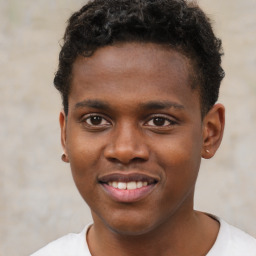 Joyful black young-adult male with short  brown hair and brown eyes