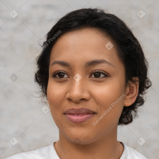 Joyful latino young-adult female with short  black hair and brown eyes